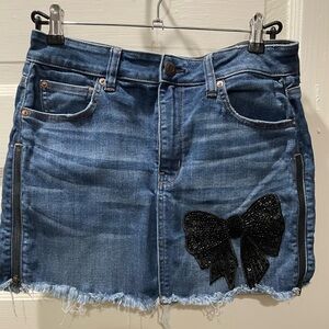 American Eagle next level stretch, Denim Skirt, size 10, with Black Bow Accent